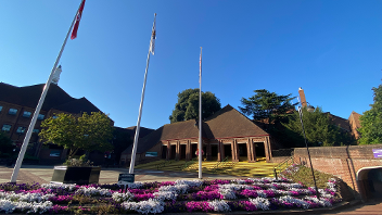 External view of the Civic Centre with blue skies and Platinum Jubilee flower bed