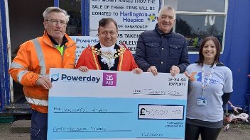 Cllr Eddie Lavery and the Mayor of Hillingdon holding a giant cheque for £50,000 standing alongside representatives from Powerday - who run the council's waste facility in West Drayton - and Hillingdon Hospice.