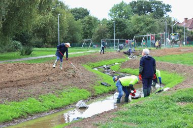 Community planting day at the flood measures in Elephant Park