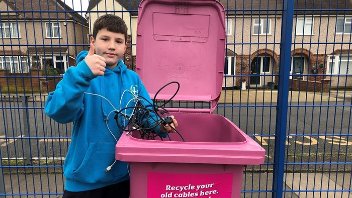 A pink wheelie bin branded for the Cable Challenge recycling competition